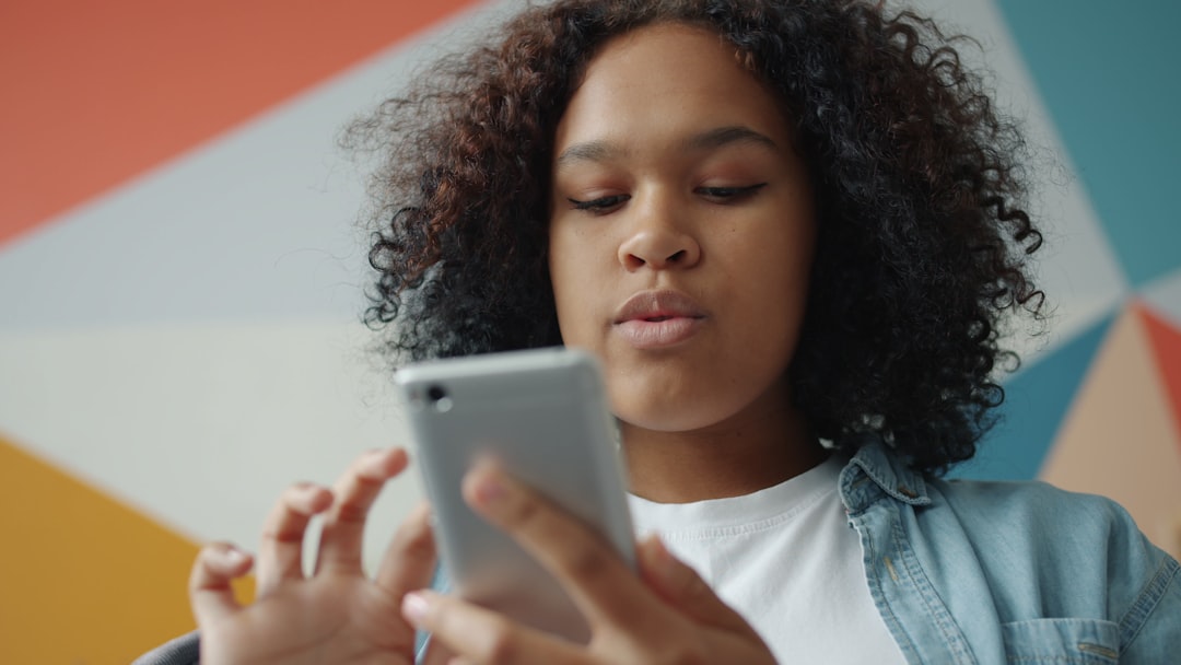 frustrated woman looking at phone screen