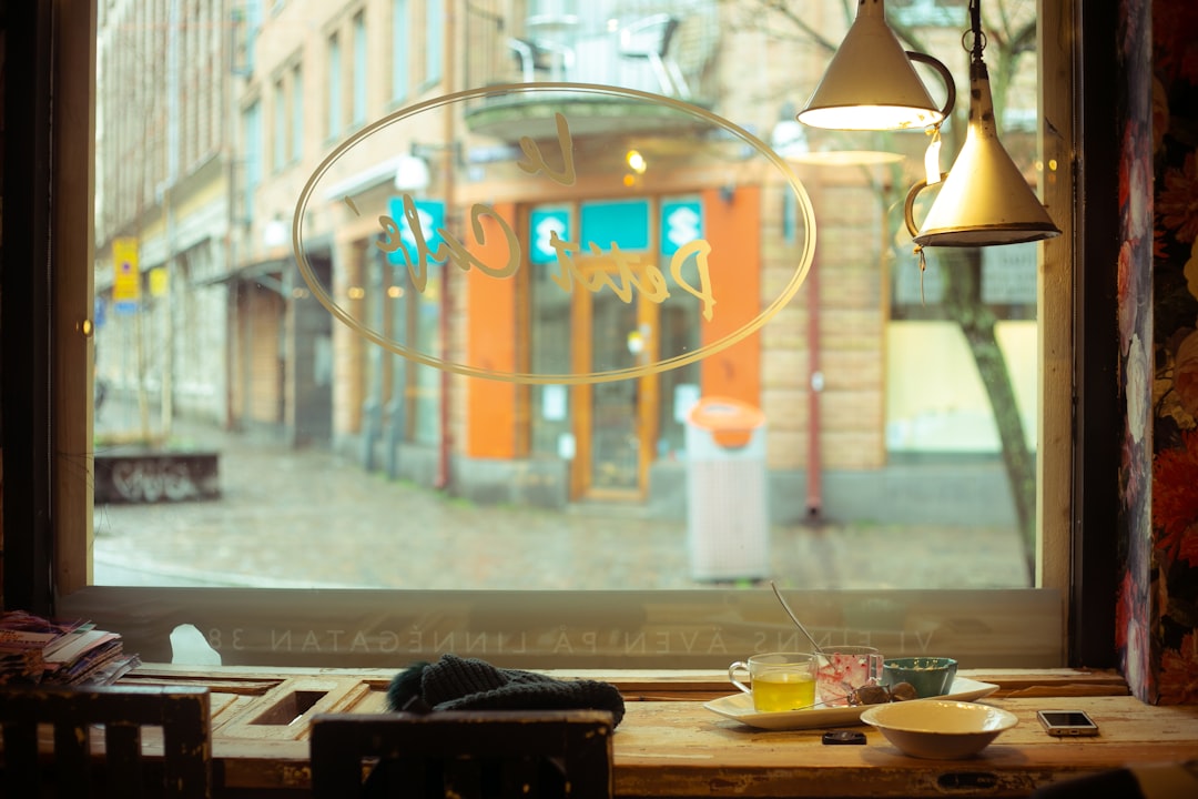man reflecting cafe window