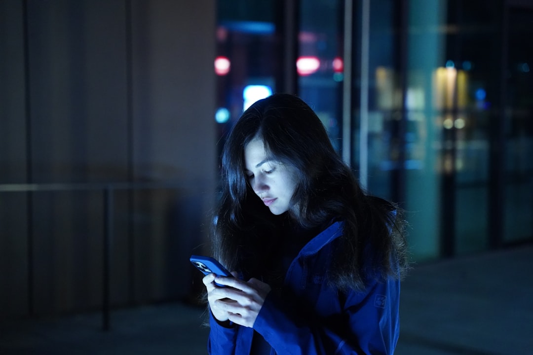 japanese woman thinking smartphone late night