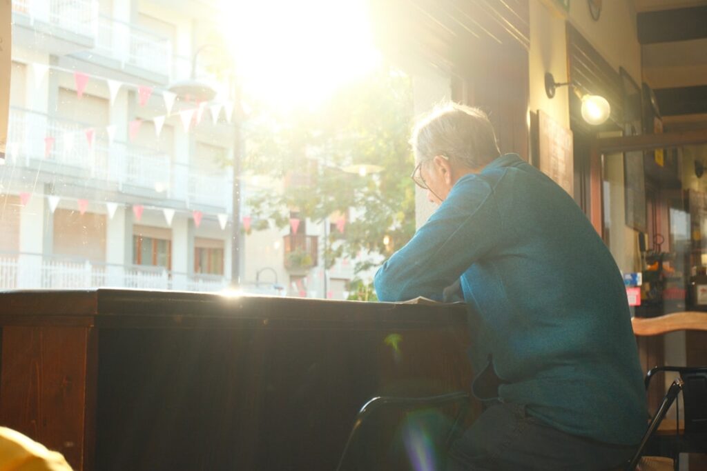 hopeful woman cafe window sunlight