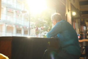 hopeful woman cafe window sunlight