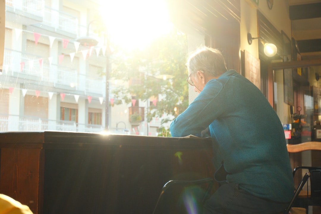 hopeful woman cafe window sunlight