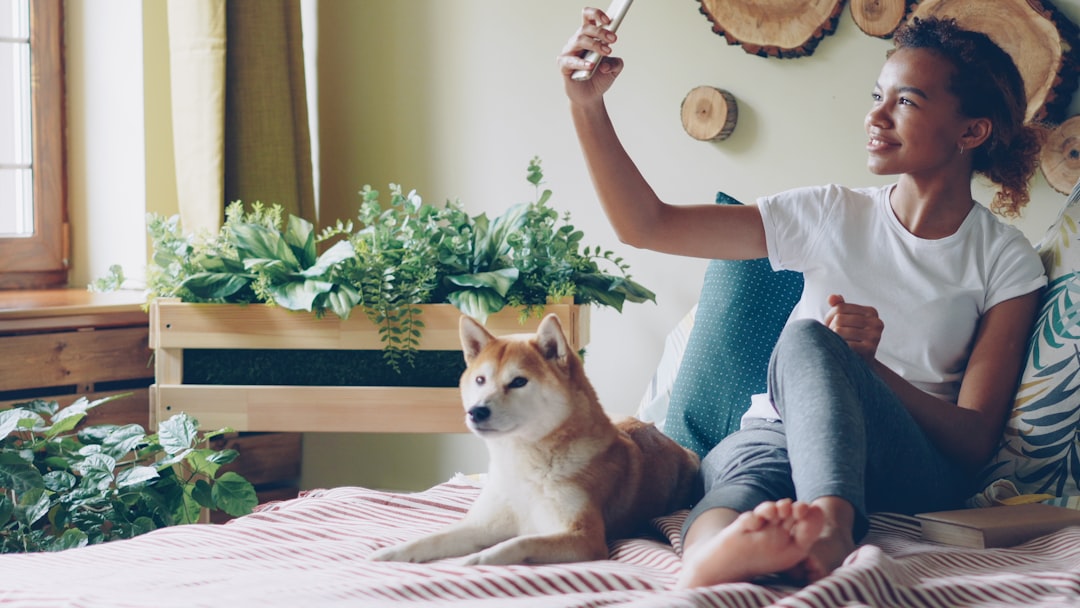 woman video call smartphone home