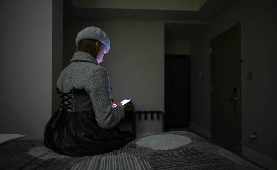 single mother using smartphone at night