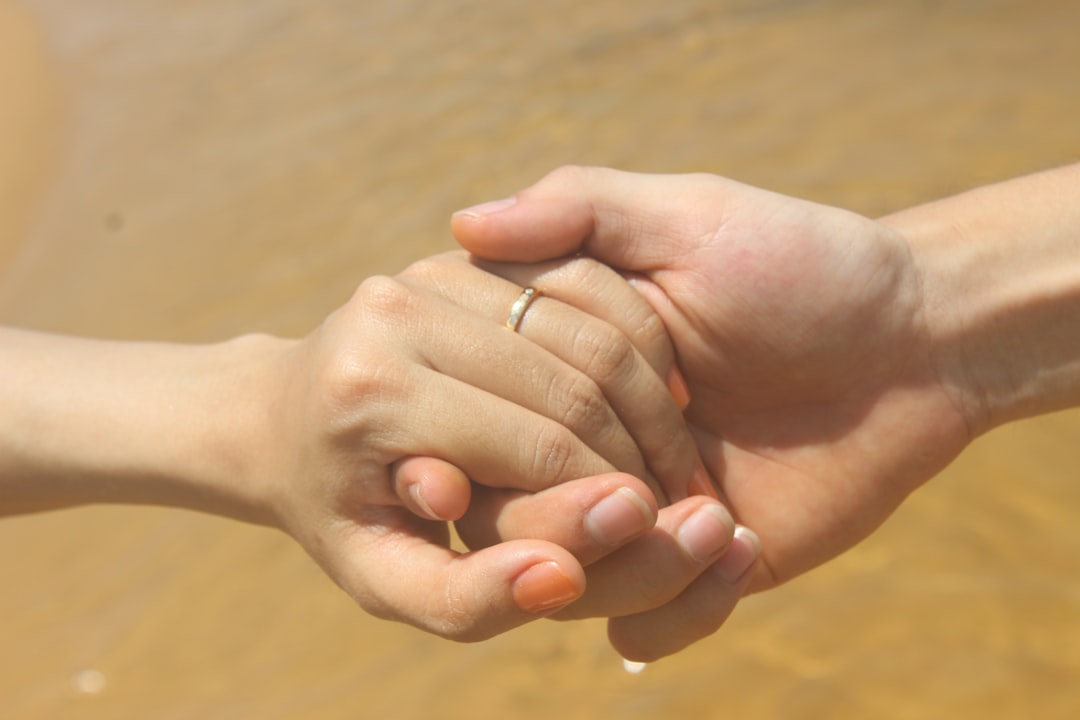 couple holding hands date