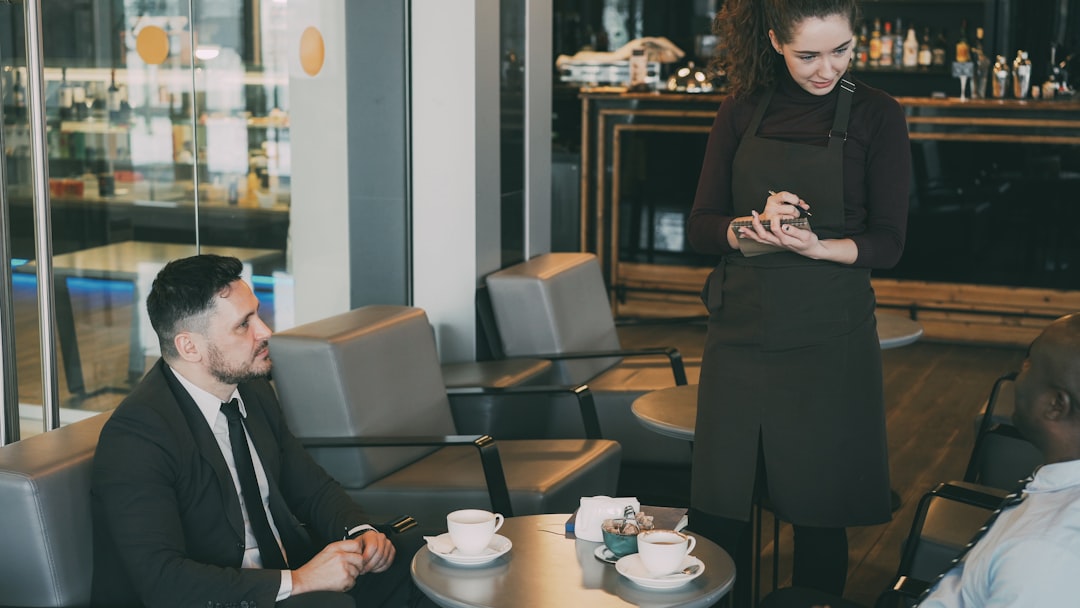 woman thinking alone at cafe with coffee
