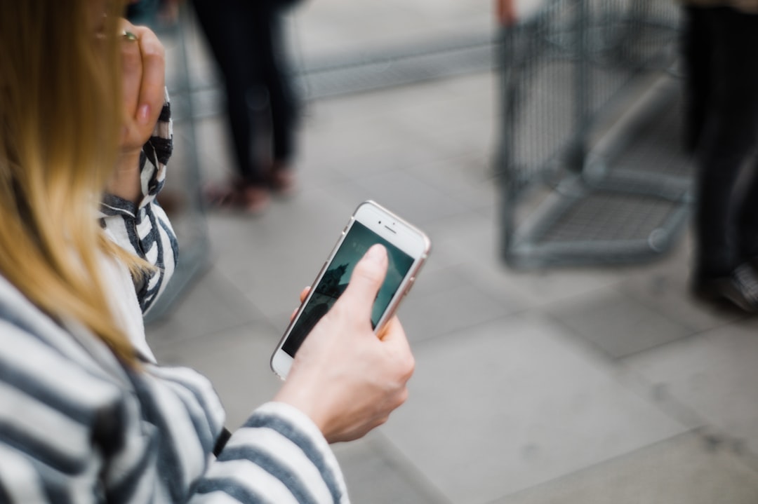 person looking worried at smartphone screen