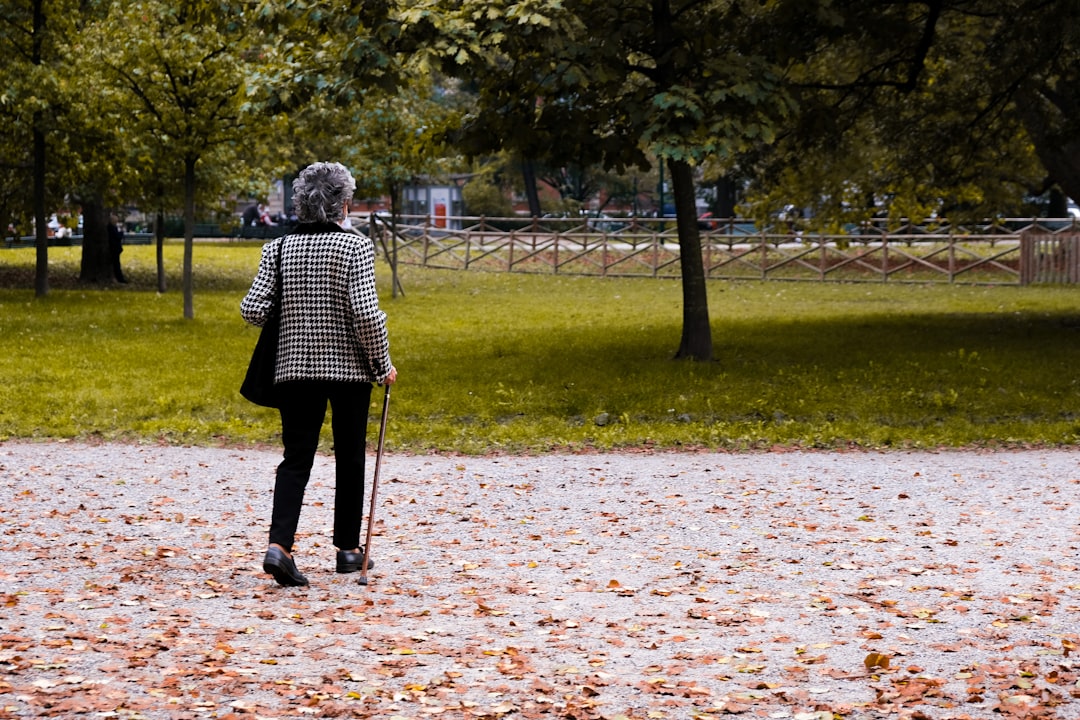 woman walking alone in park thinking