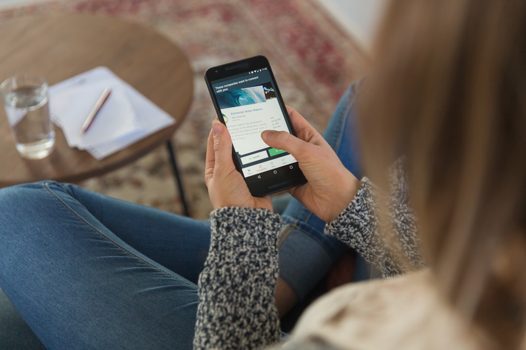 woman checking price plan on smartphone