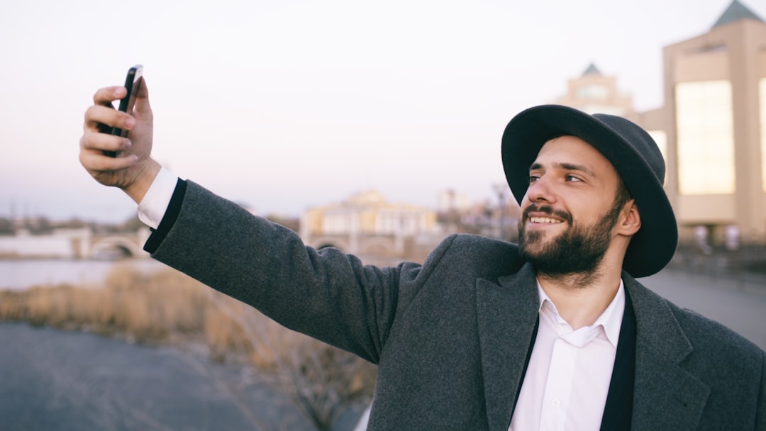 man taking profile selfie outdoors