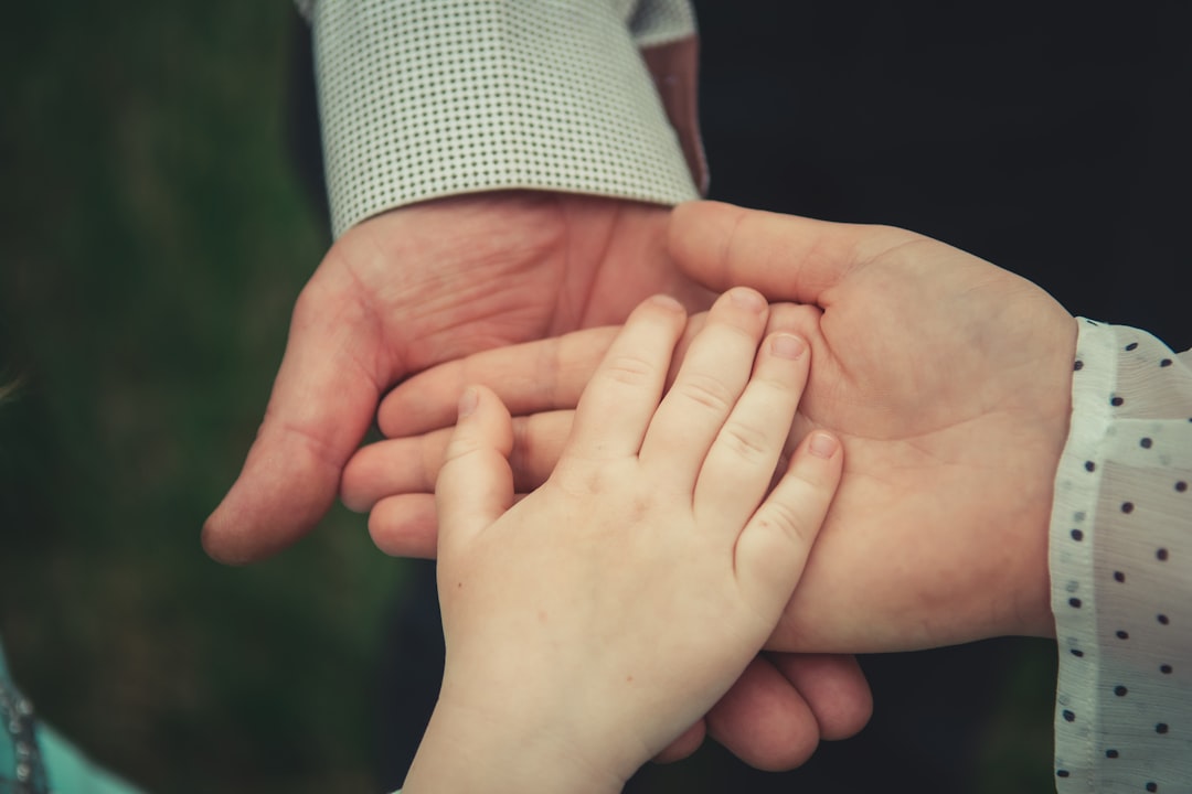 father and child holding hands