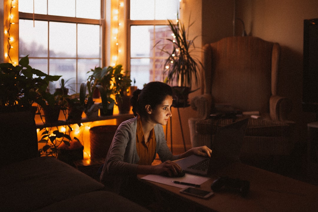 japanese woman calculating budget at home night