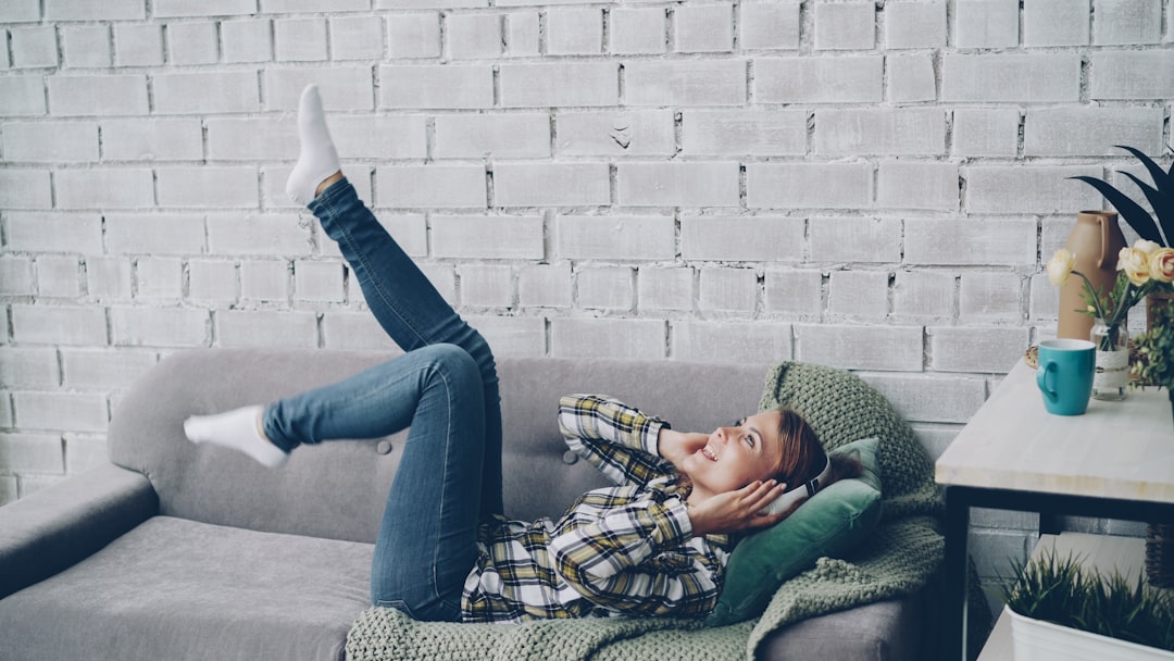 relieved woman relaxing at home sofa