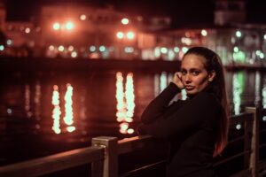 confident businesswoman thinking alone at night