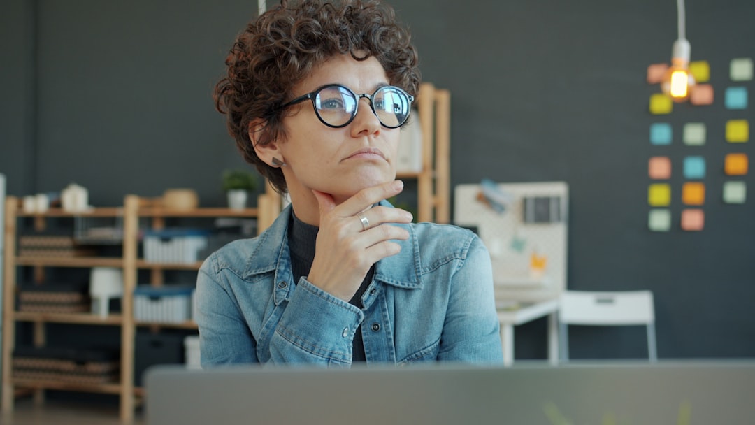 woman thinking worried at desk