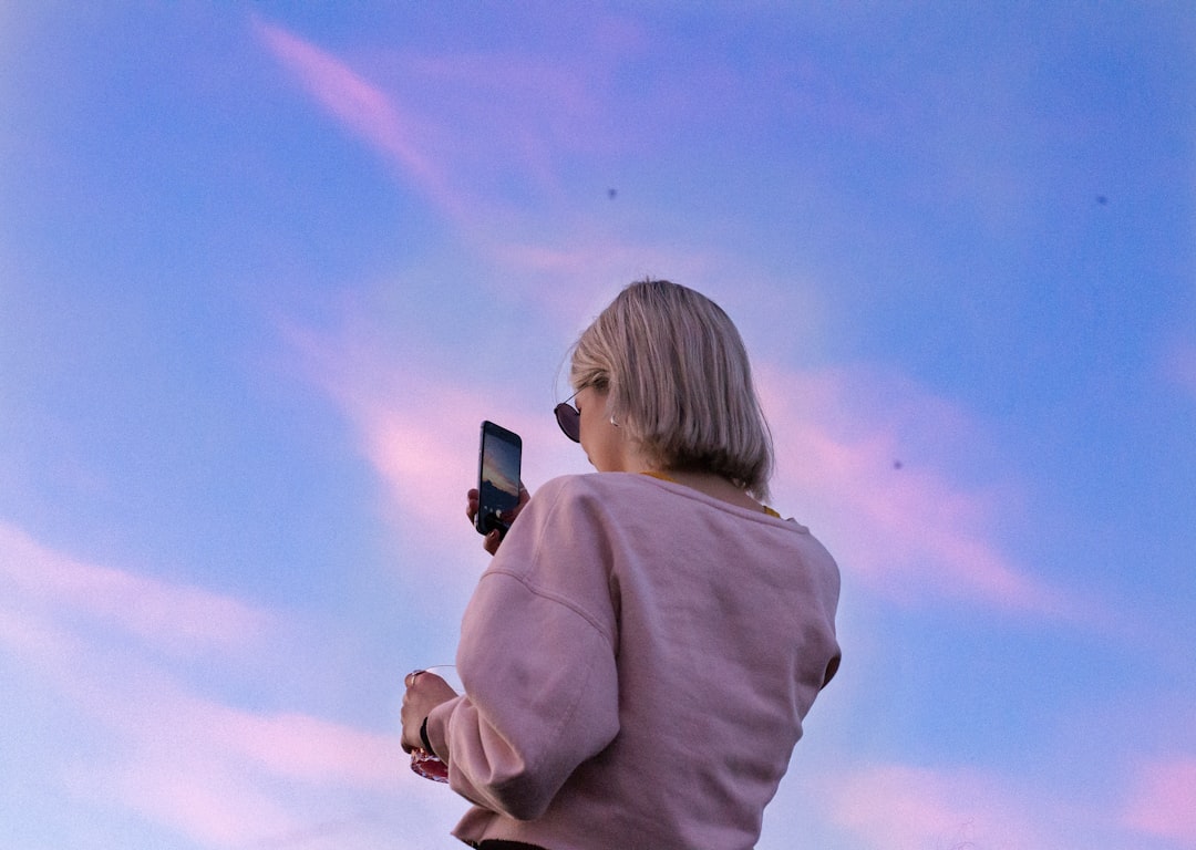 woman using smartphone hopeful mood