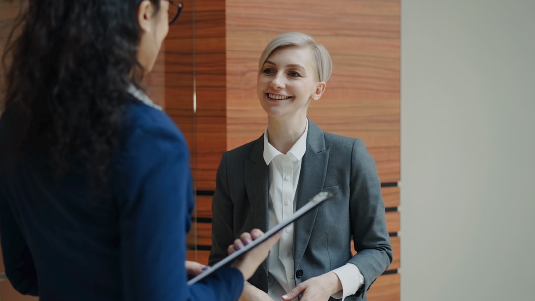 smiling woman consulting counselor at office