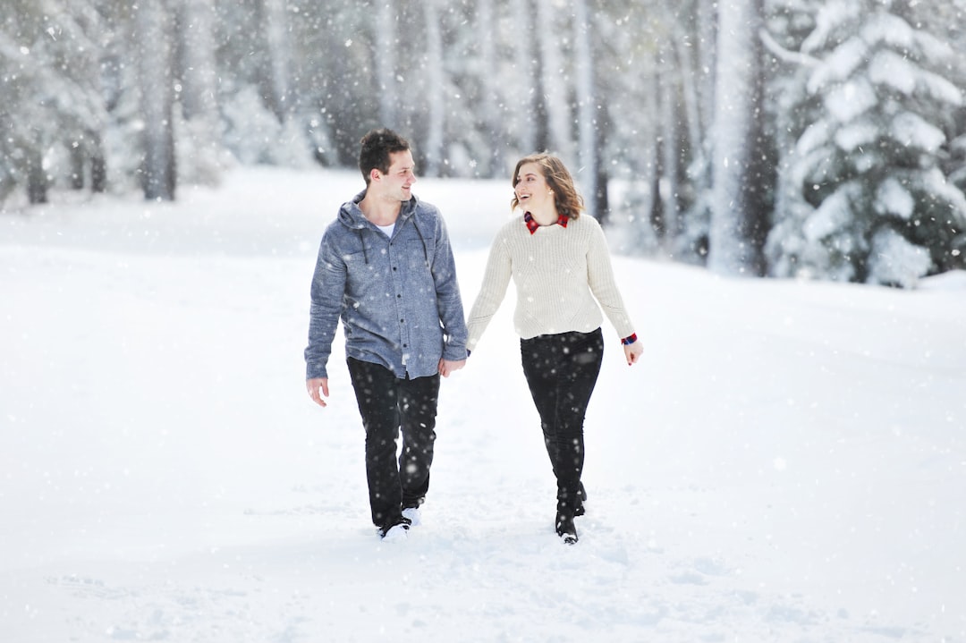 happy couple holding hands outdoors