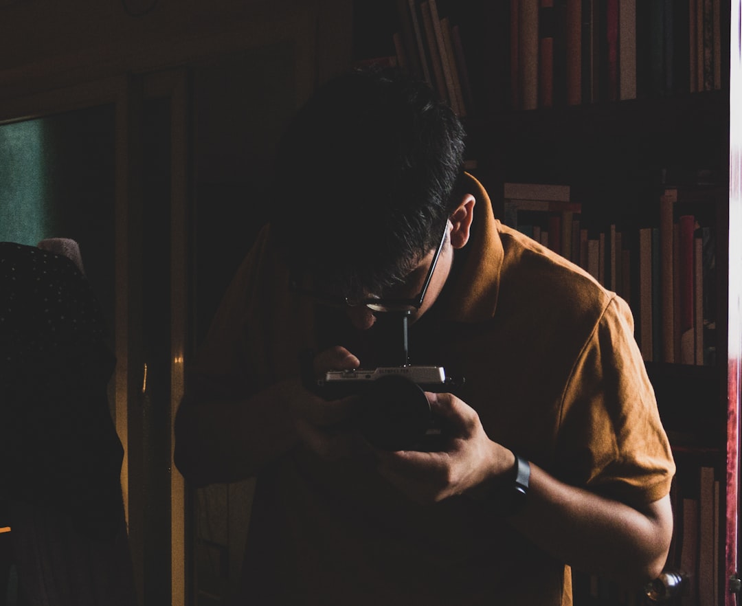person concerned looking phone dark