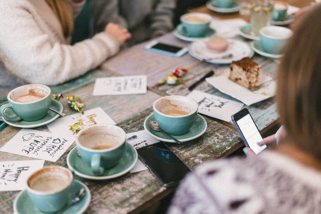 people reading reviews online cafe