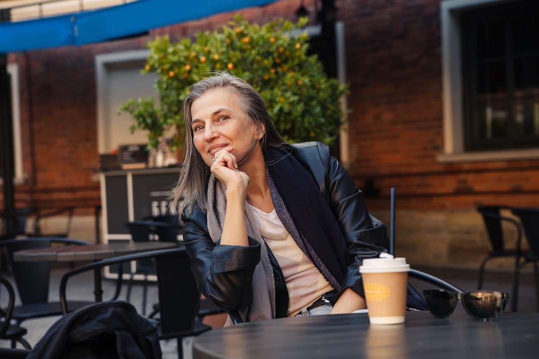 happy woman thinking decision cafe