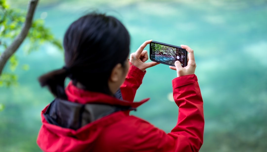 japanese woman taking natural profile photo outdoors