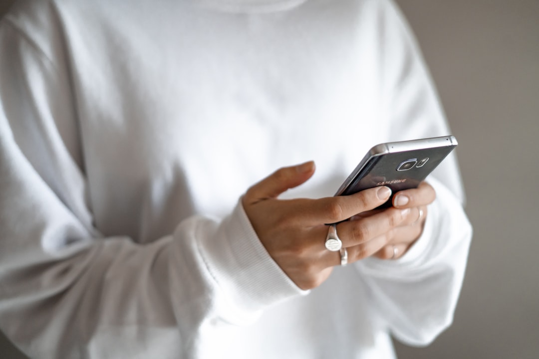 person filling online form phone