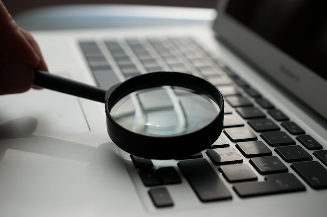 magnifying glass searching photo on screen