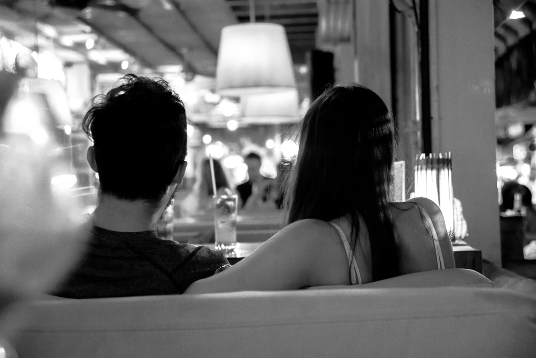 couple sitting apart on couch