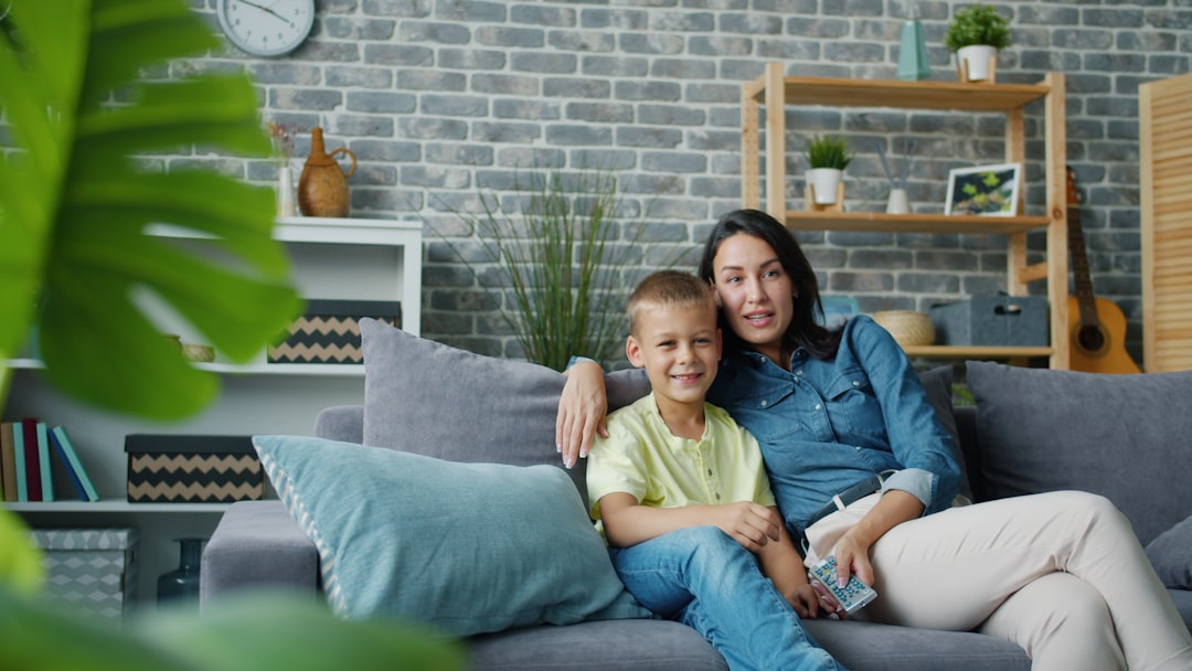 single mother smiling with child at home