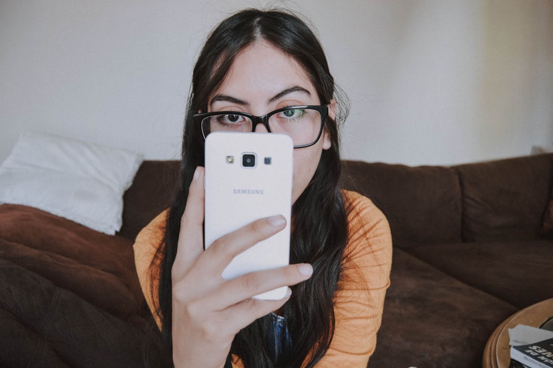 person worried looking at phone screen