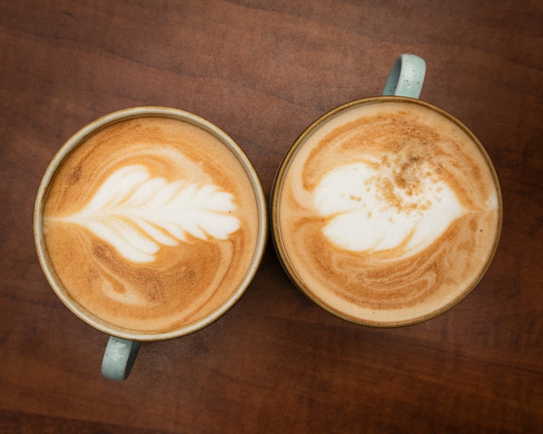 two coffee cups on cafe table