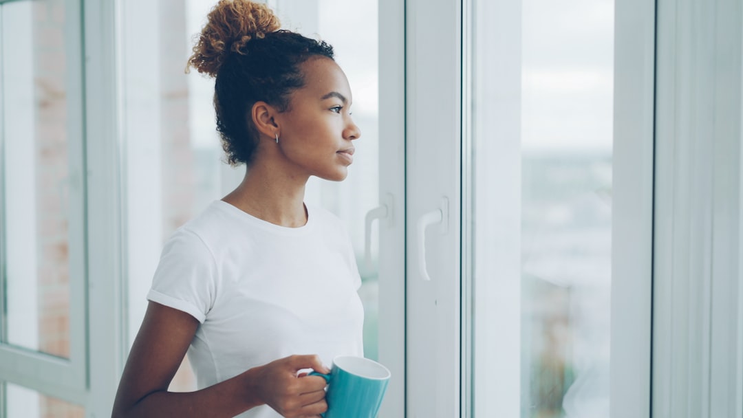 woman relaxing home coffee window