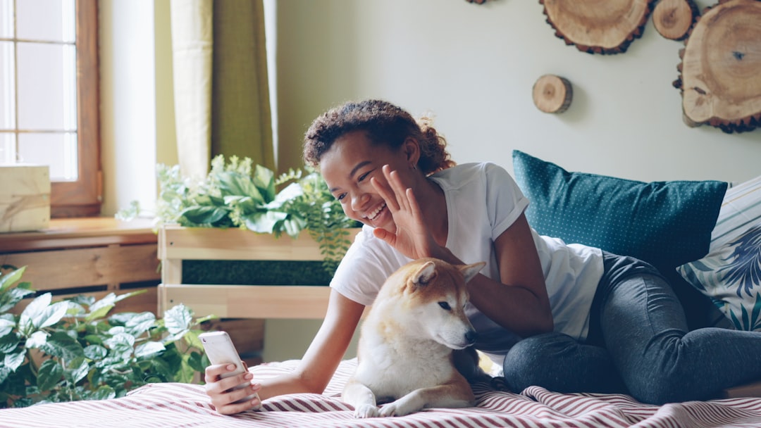 woman video call smartphone home