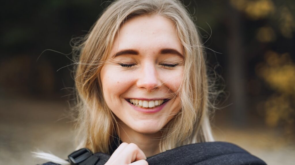 woman smiling relieved outdoors