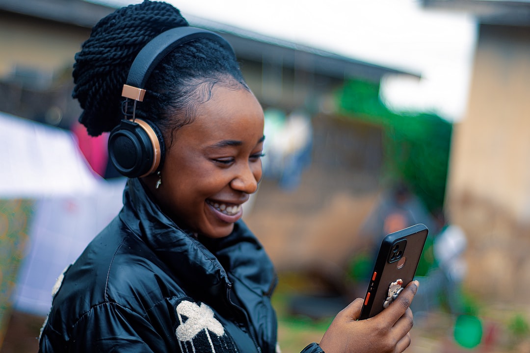 woman writing profile on phone smiling