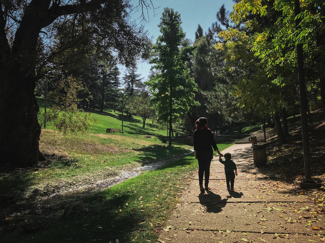 happy single mother and child in park
