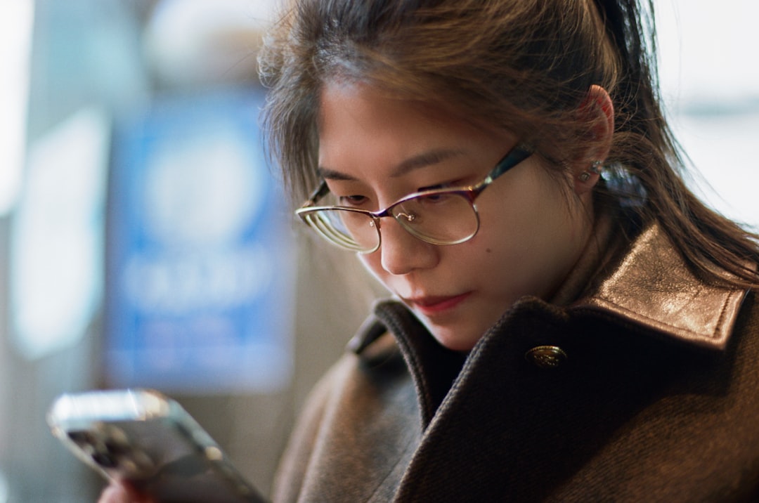 young japanese woman choosing smartphone apps