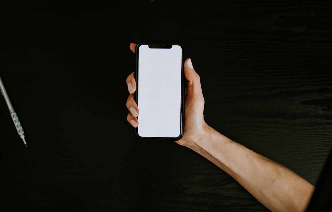 hands holding smartphone app screen