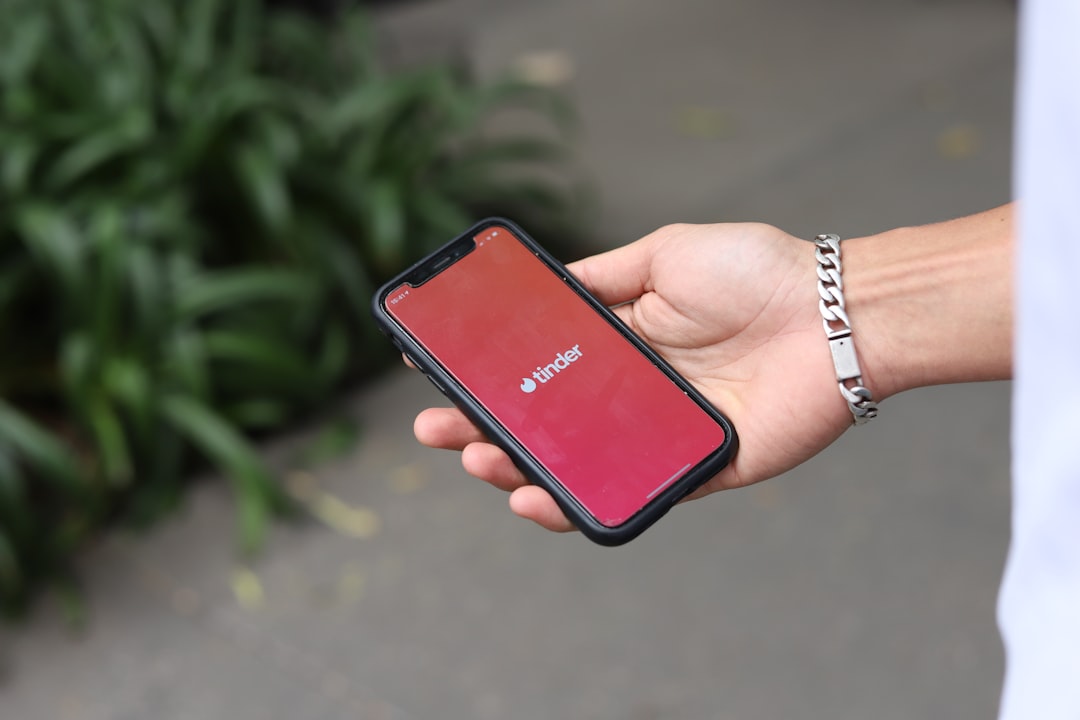 hand smartphone dating app registration