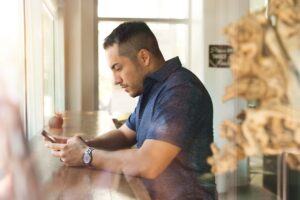 middle aged man smartphone dating app