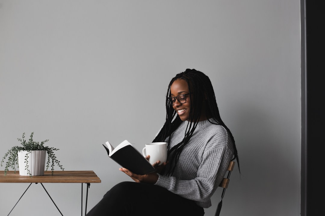 young woman relaxing coffee book