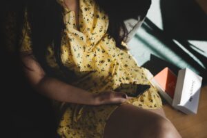 woman using dating app on smartphone calm