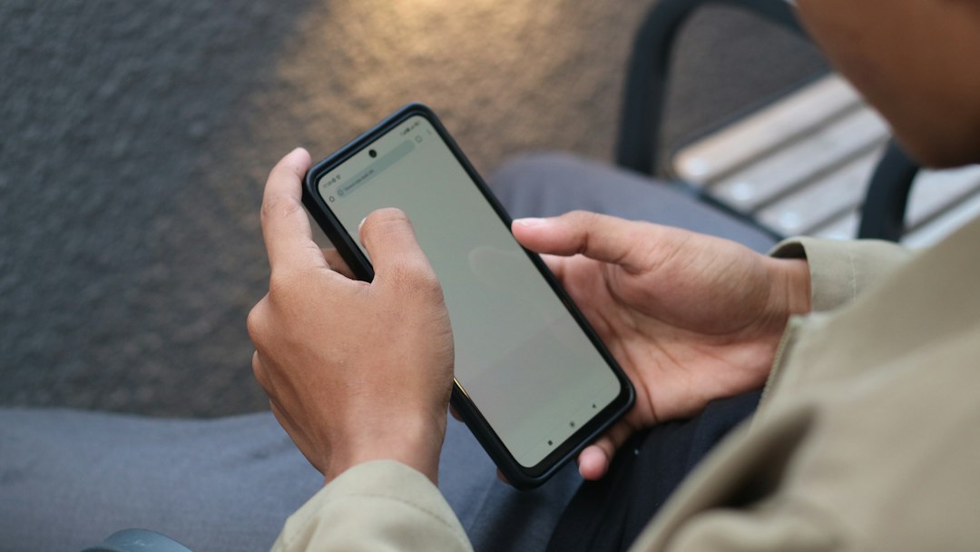 person checking security notification on smartphone