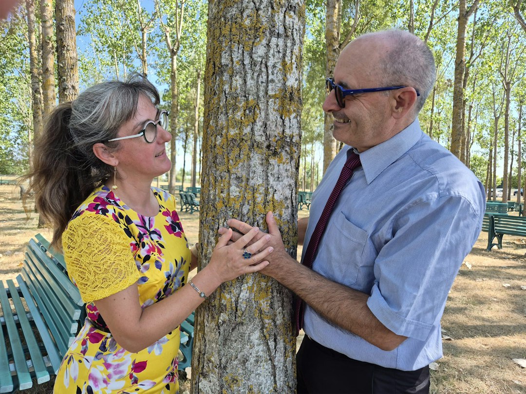 happy mature couple holding hands outdoor