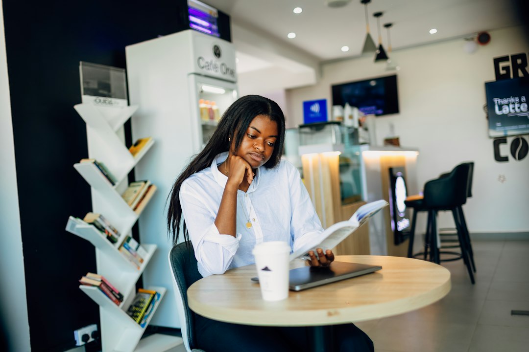 young woman thinking coffee shop