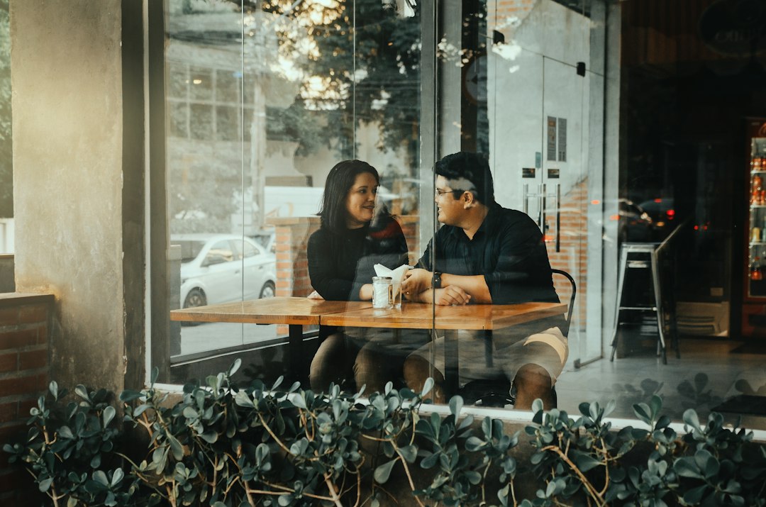 couple having deep conversation cafe