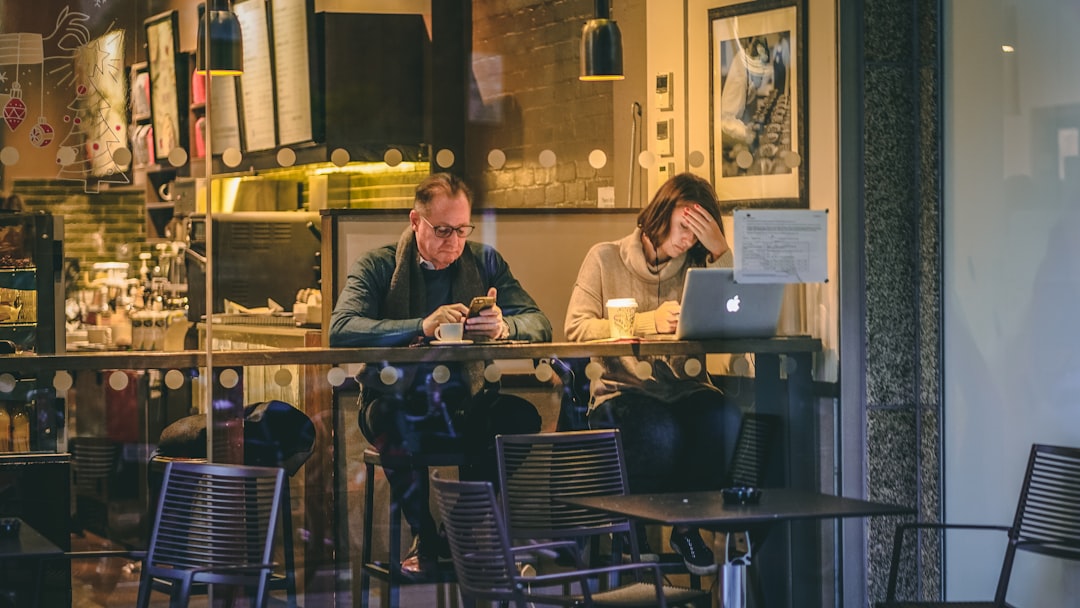 two people distant conversation cafe