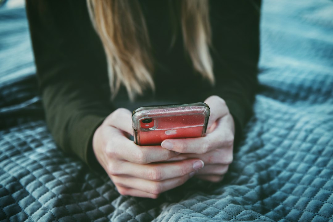 woman using smartphone dating app