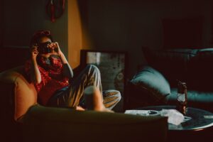 woman using smartphone at home evening warm light